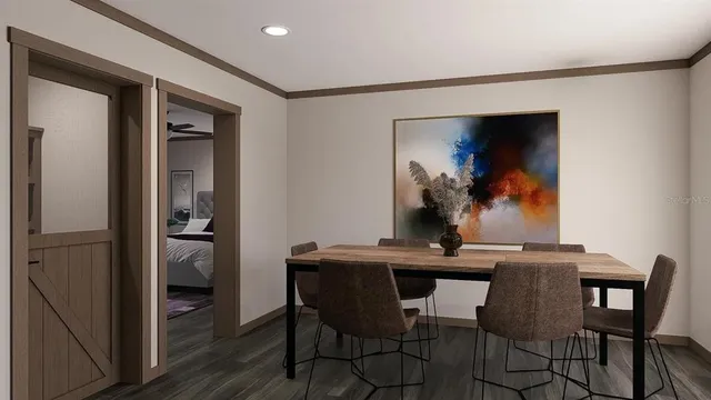 a dining room with a table and chairs