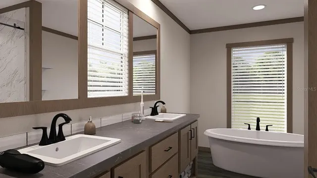 a bathroom with a double vanity sink toilet and a mirror