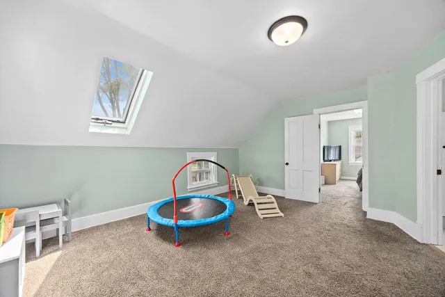 a view of bathroom with a toilet sink and mirror