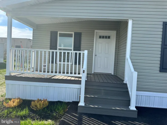 a view of a balcony with furniture