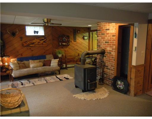 1661 Dexter Road Dover-Foxcroft, ME 04426 - Photo 19 of 20 Den/Family/Great Room. Wood stove in...