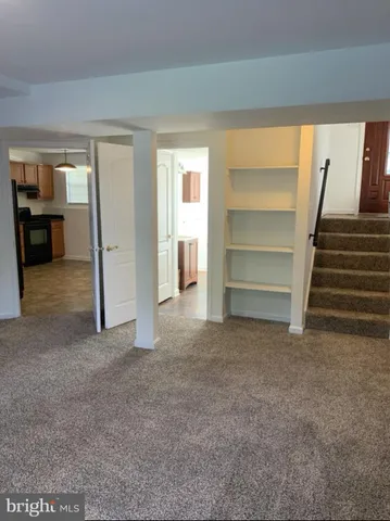 a view of an empty room and a cabinet