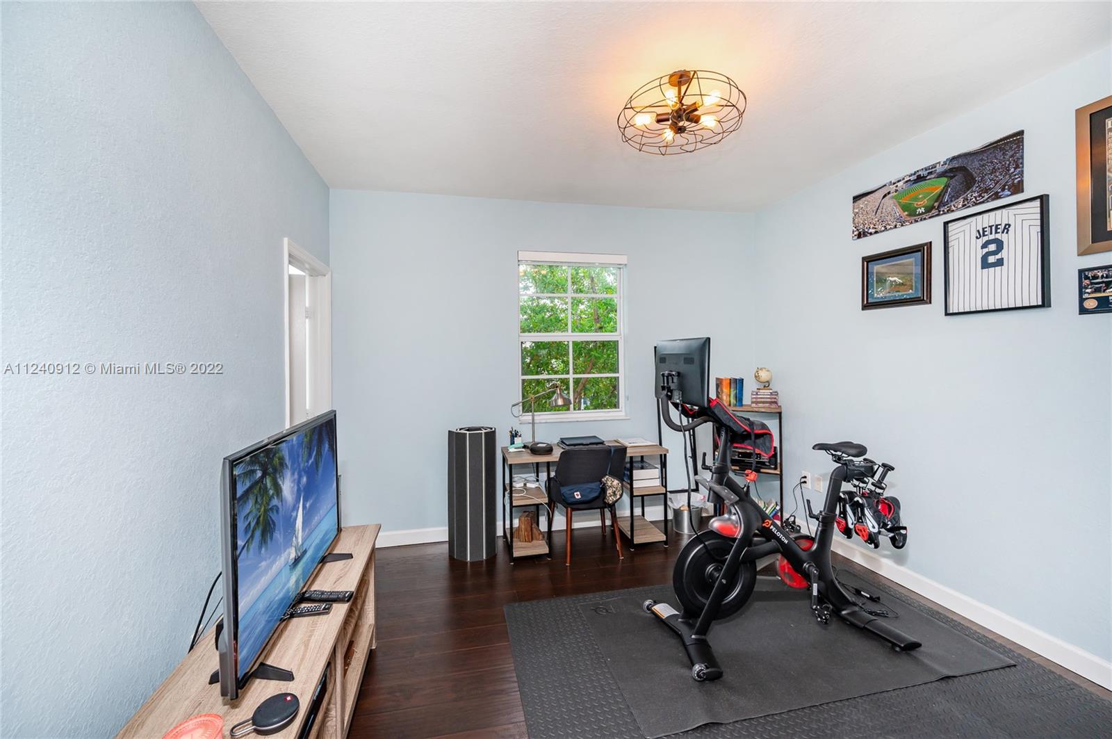 9031 Southwest 227th Street, Unit 9 Cutler Bay, FL 33190 - Photo 15 of 20 a view of a workspace with furniture and a window