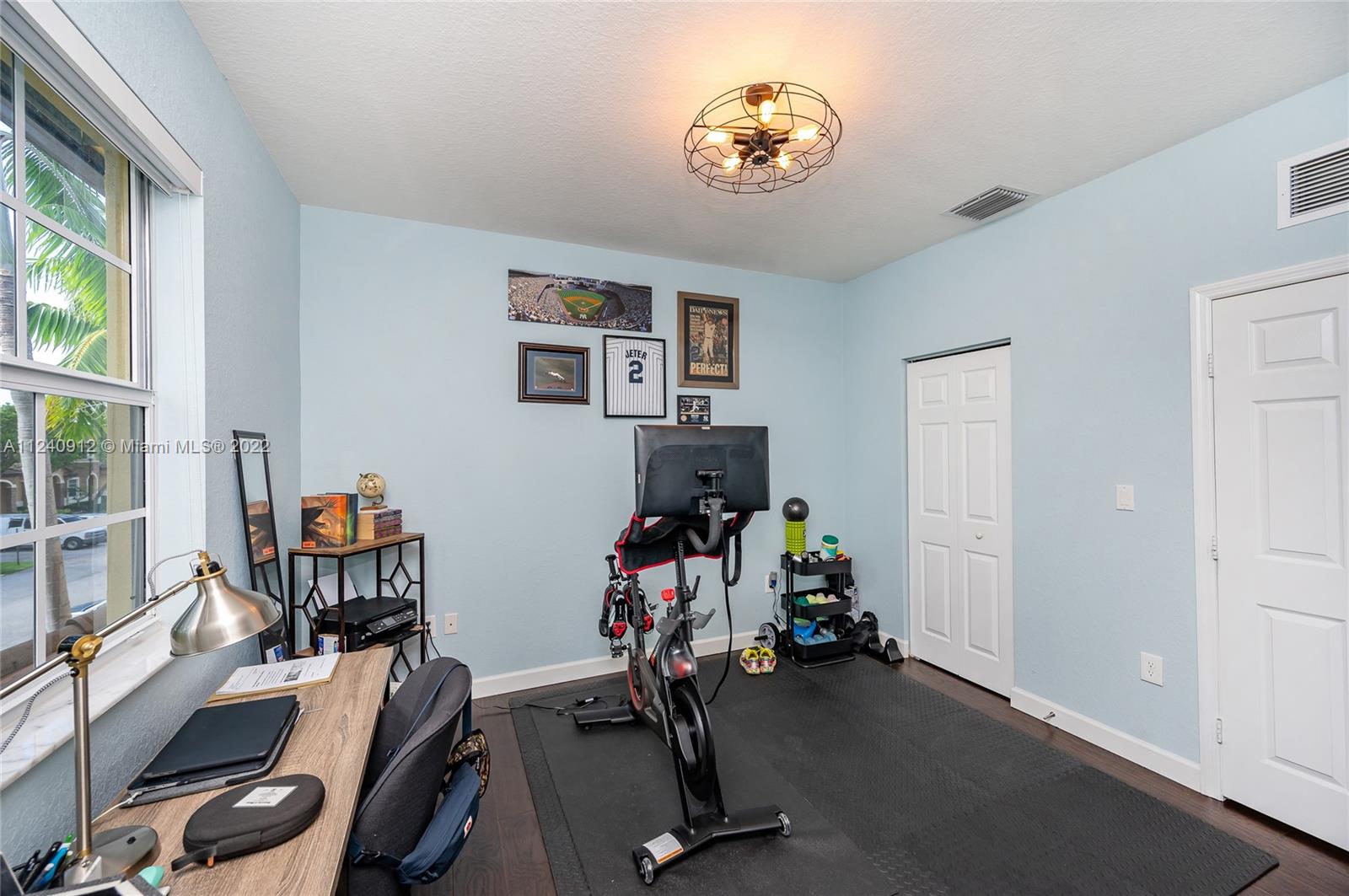 9031 Southwest 227th Street, Unit 9 Cutler Bay, FL 33190 - Photo 16 of 20 a view of a room with gym equipment