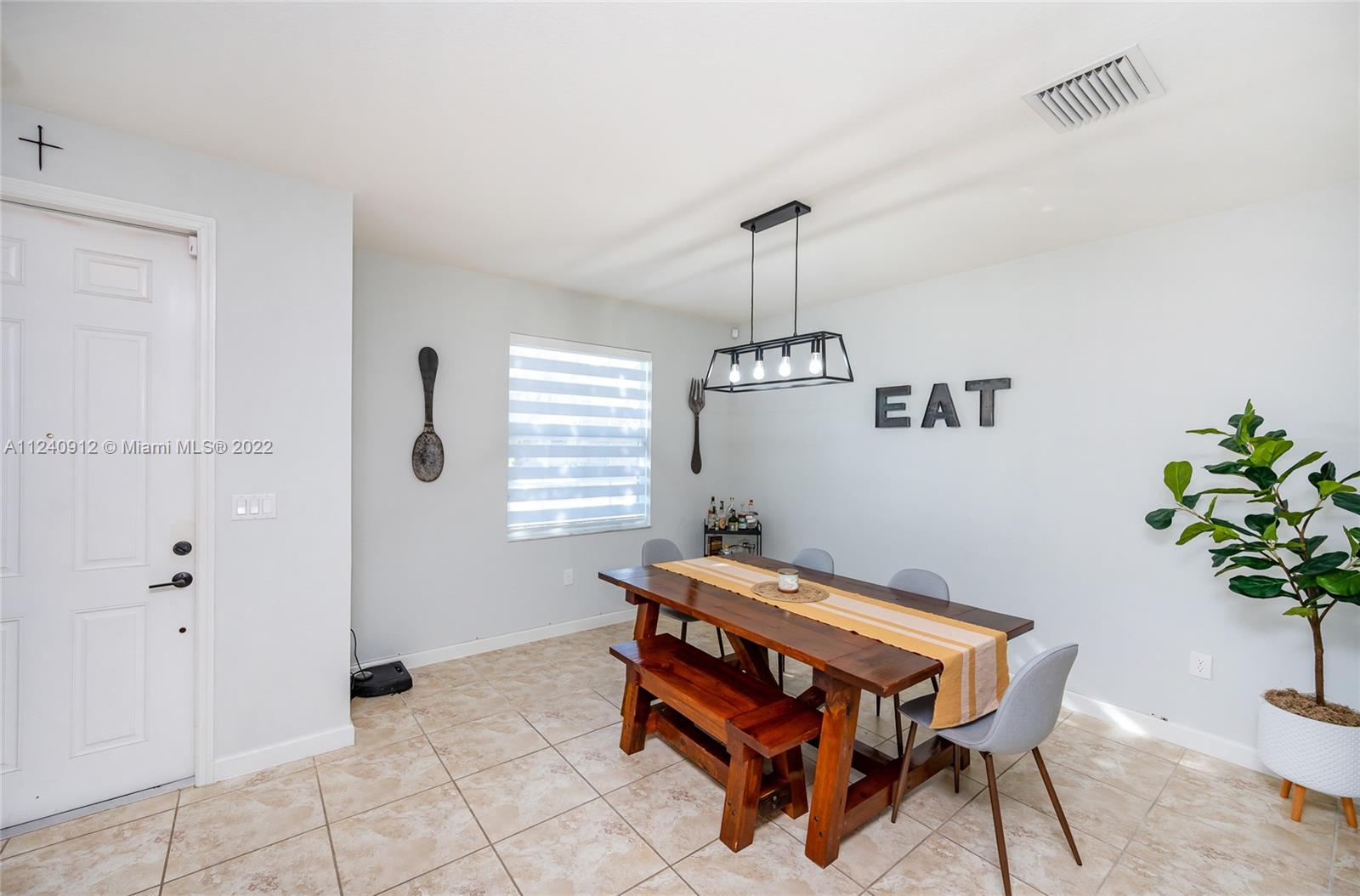 9031 Southwest 227th Street, Unit 9 Cutler Bay, FL 33190 - Photo 2 of 20 a room with furniture