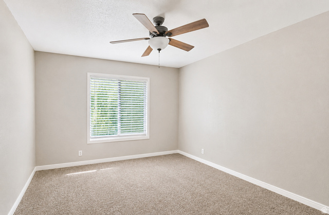6907 South 745th Street East, Unit G Midvale, UT 84047 - Photo 15 of 30 Large second bedroom