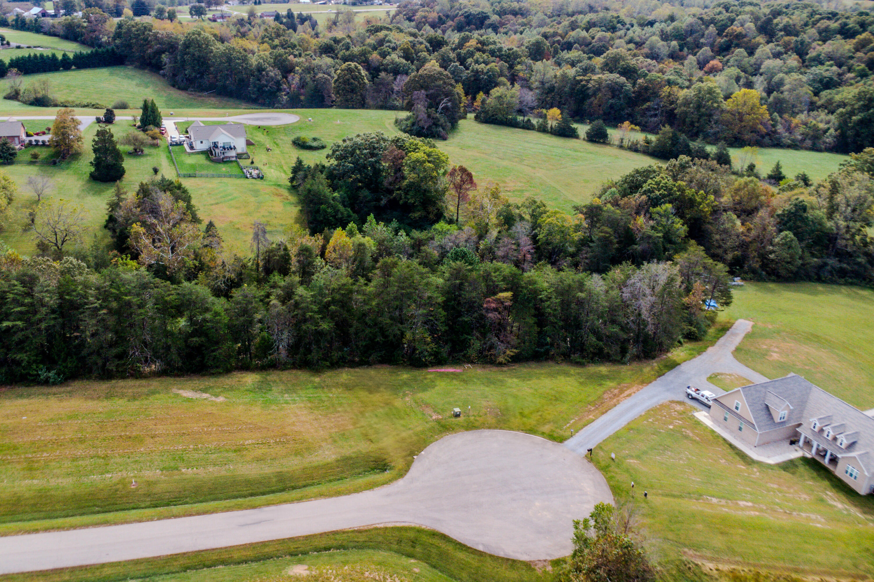 Lot 22 Nyle Ridge Road Wirtz, VA 24184 - Photo 2 of 8 an aerial view of a house with a yard and lake view