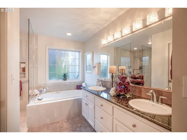 a bathroom with a bathtub and a shower