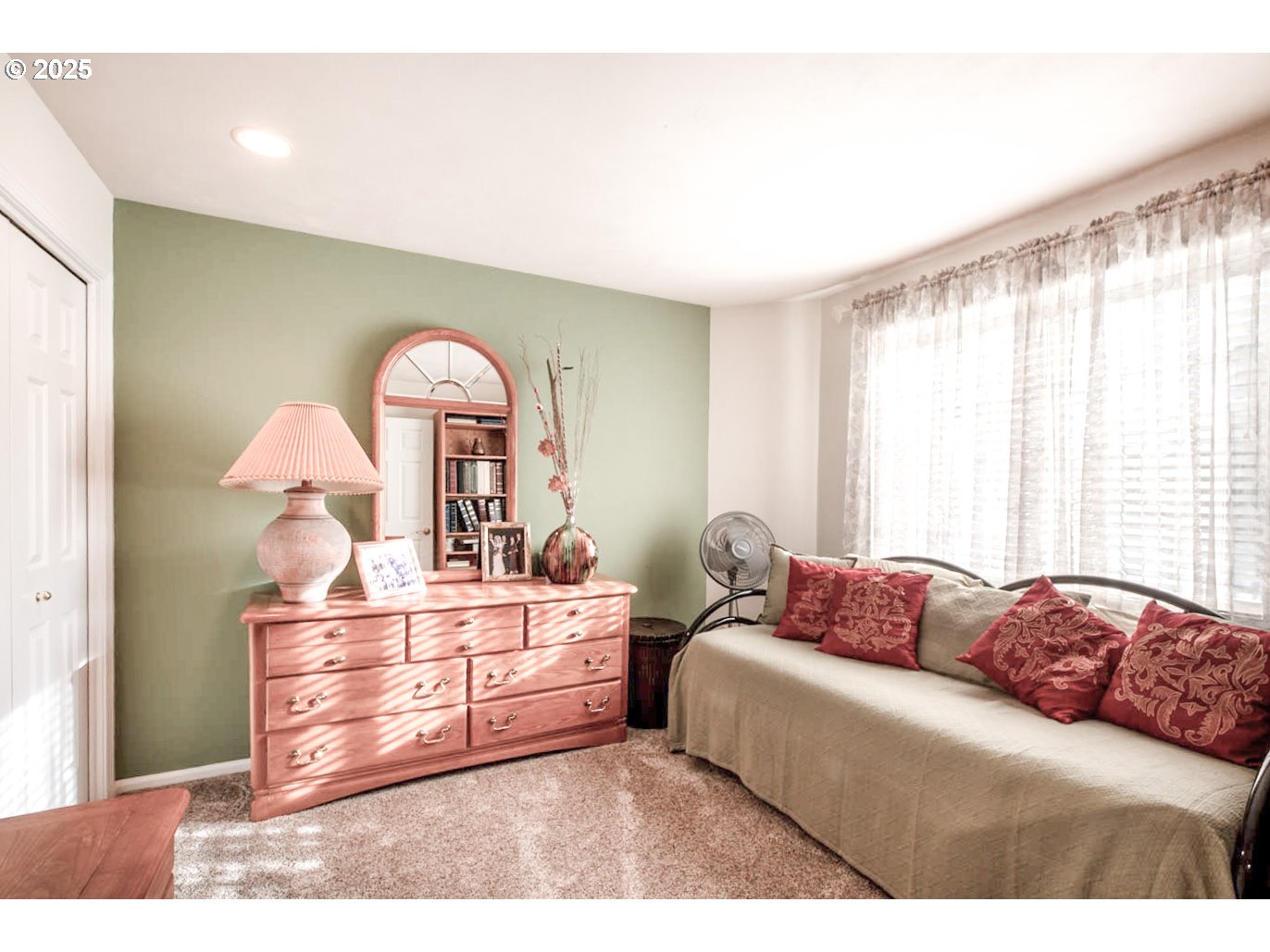 3152 Wolf Meadows Lane Eugene, OR 97408 - Photo 16 of 27 a living room with a bed mirror and a window