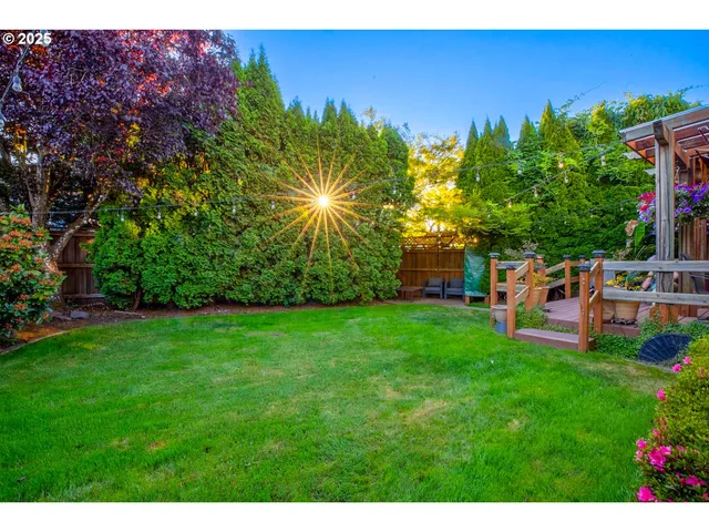 a view of a patio with table and chairs potted plants with wooden floor
