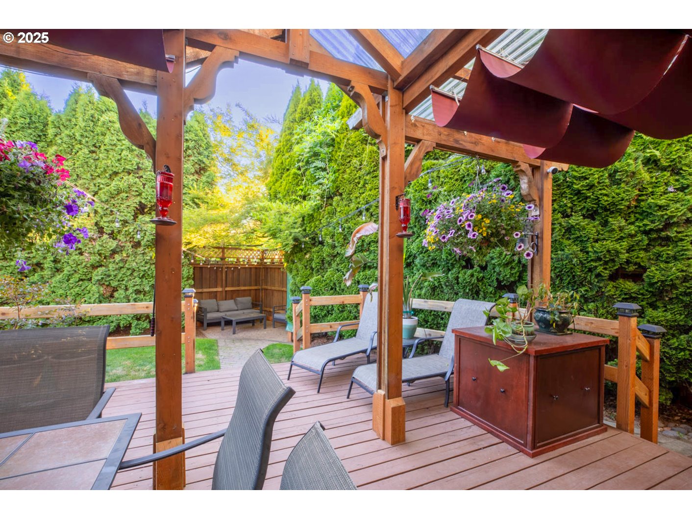 3152 Wolf Meadows Lane Eugene, OR 97408 - Photo 22 of 27 a view of a floor with a table and chairs under an umbrella