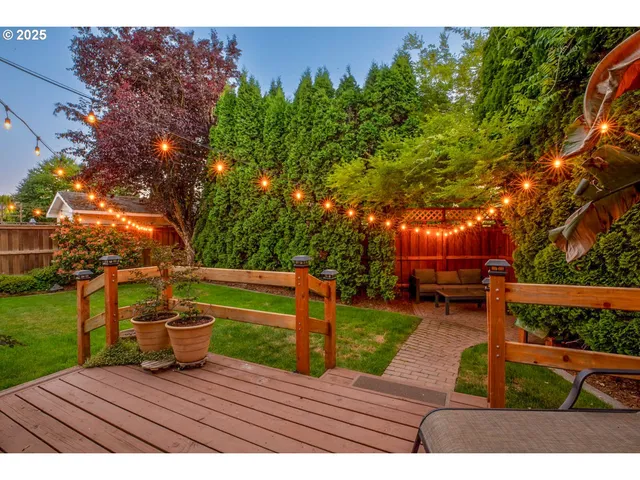 a view of a backyard with sitting area