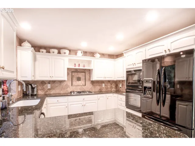 a bedroom with a bed and a tv on the dresser