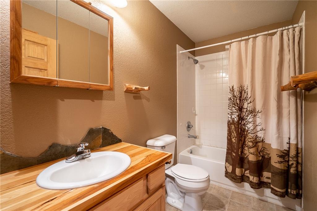 95 Ute Way Como, CO 80432 - Photo 4 of 27 a bathroom with a sink toilet and shower