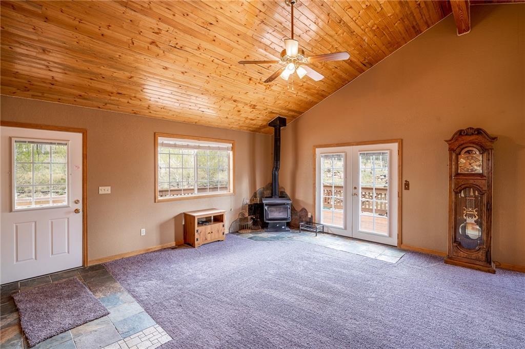 95 Ute Way Como, CO 80432 - Photo 6 of 27 an empty room with windows closet and livingroom