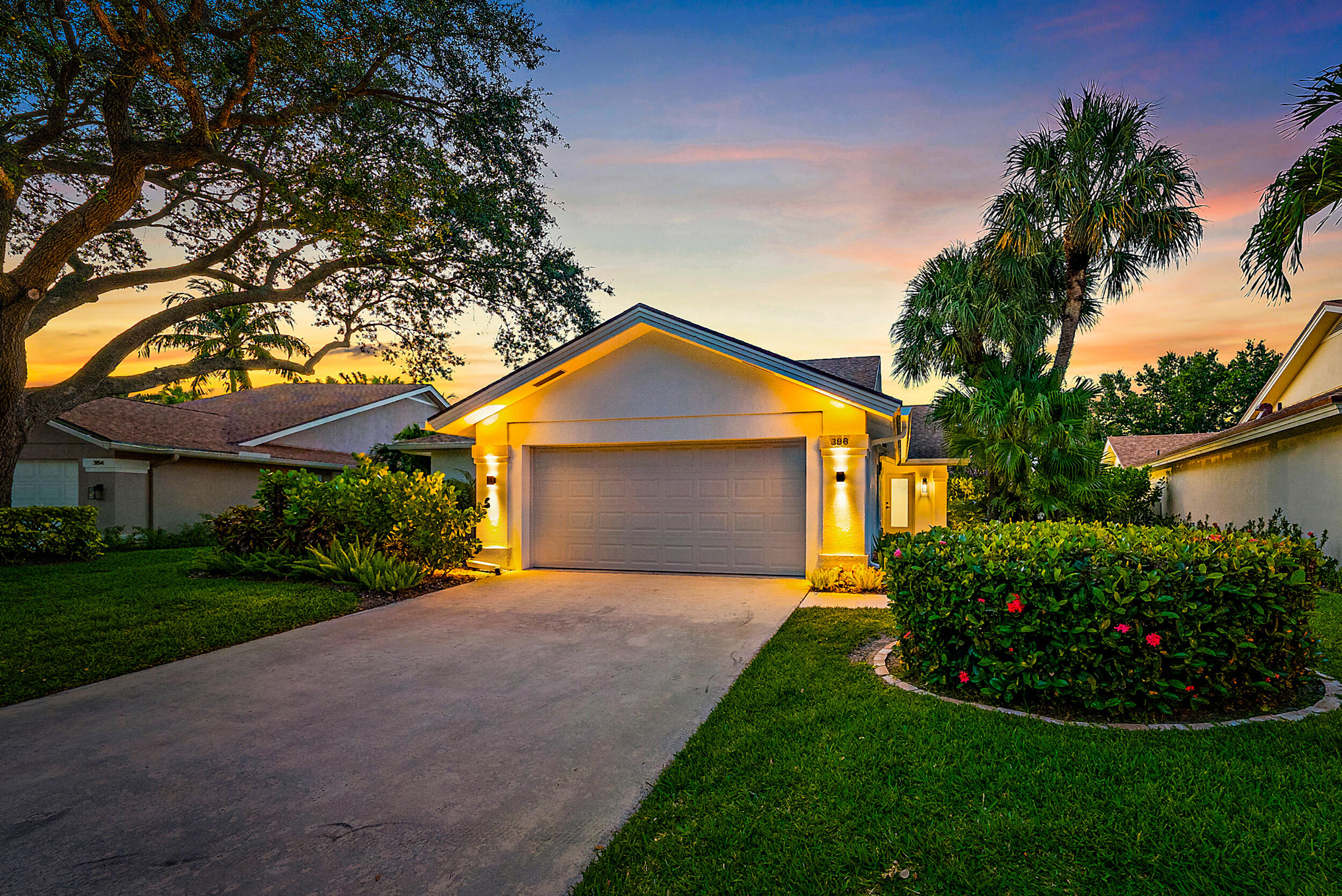 a front view of a house with a garden and entryway