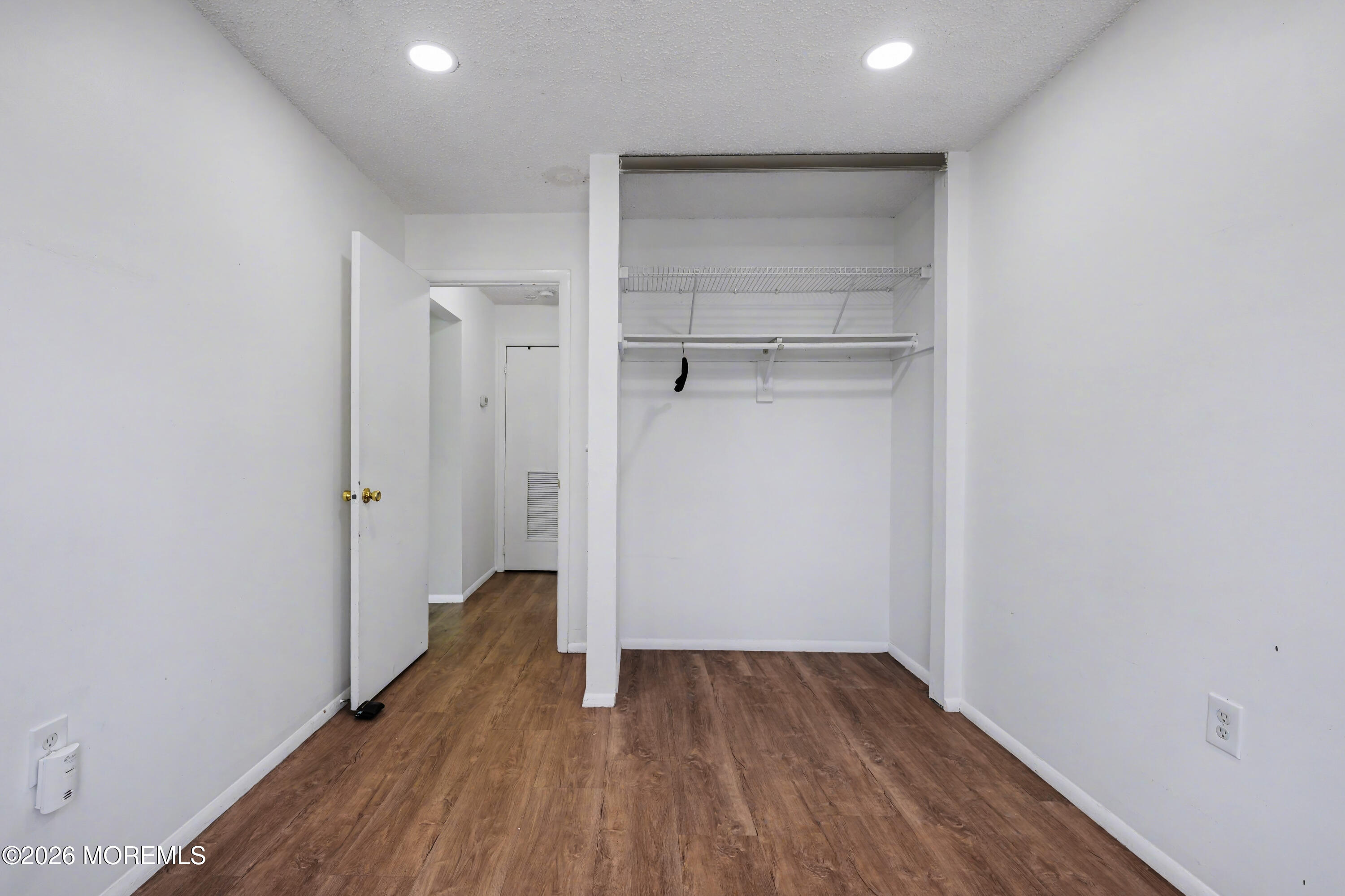1807 Lilly Lane Jackson, NJ 08527 - Photo 12 of 31 a view of an empty room with wooden floor and closet
