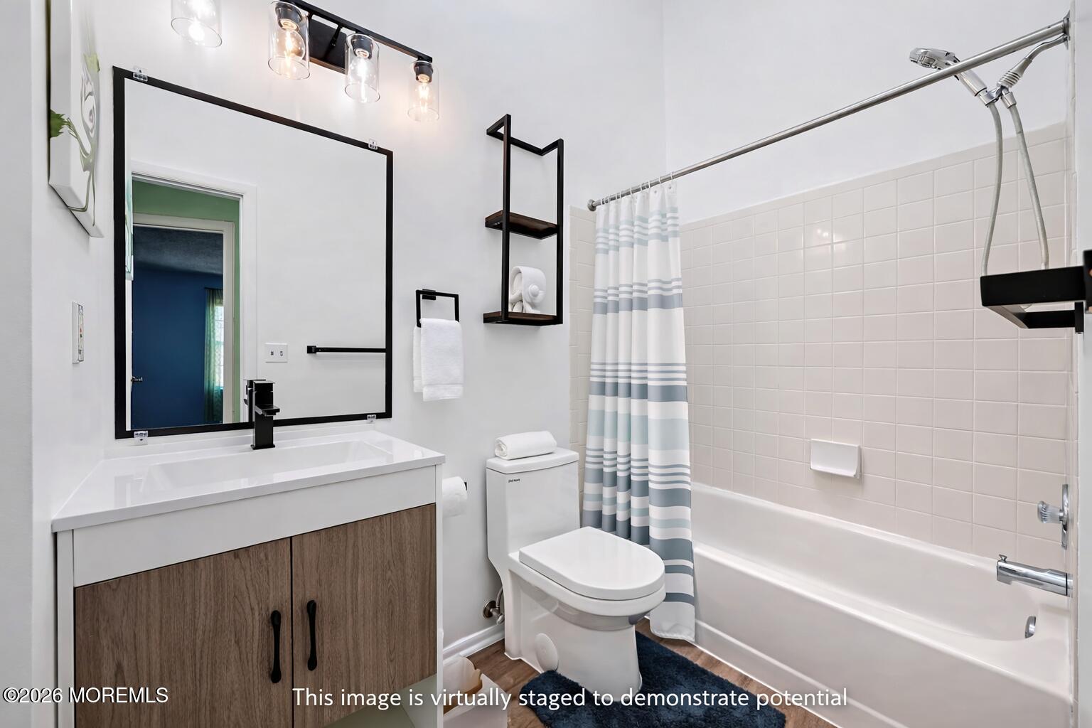 1807 Lilly Lane Jackson, NJ 08527 - Photo 20 of 31 a bathroom with a sink a toilet and shower