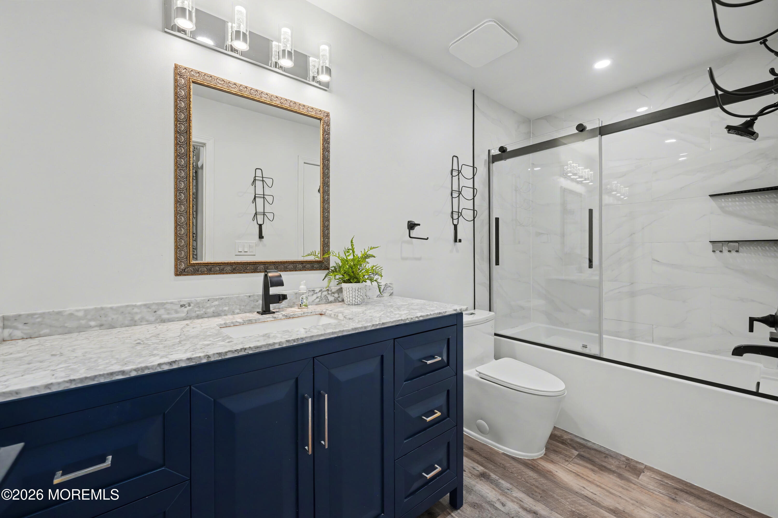 1807 Lilly Lane Jackson, NJ 08527 - Photo 29 of 31 a bathroom with a granite countertop sink mirror toilet and shower