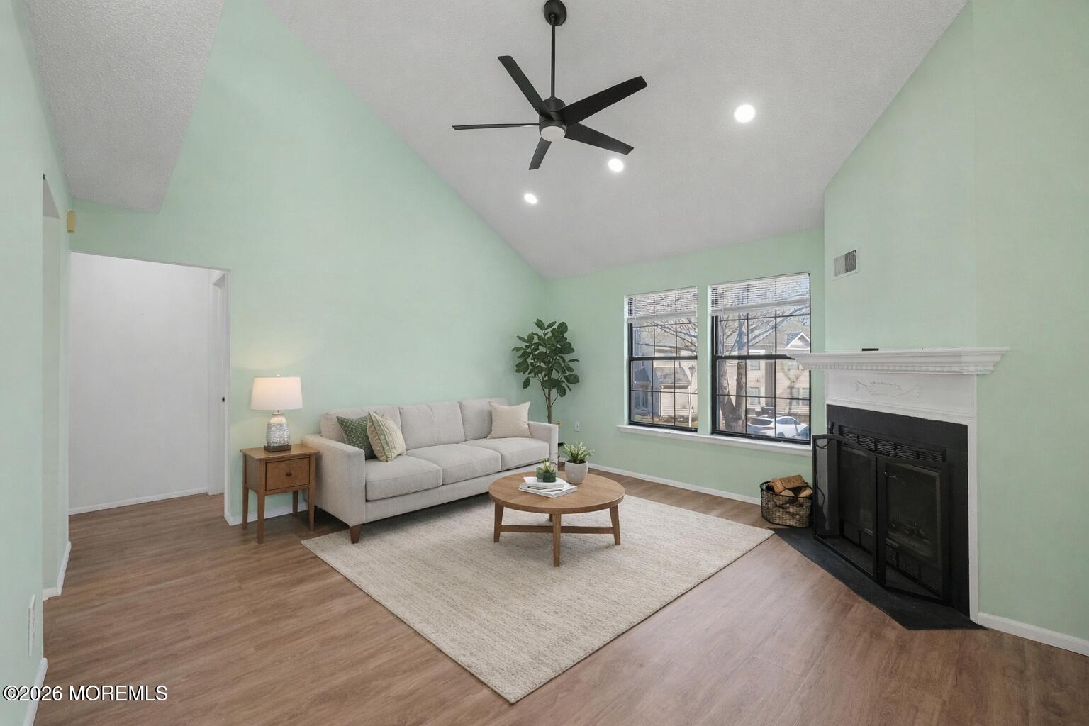 1807 Lilly Lane Jackson, NJ 08527 - Photo 5 of 31 a living room with furniture a window and a fireplace
