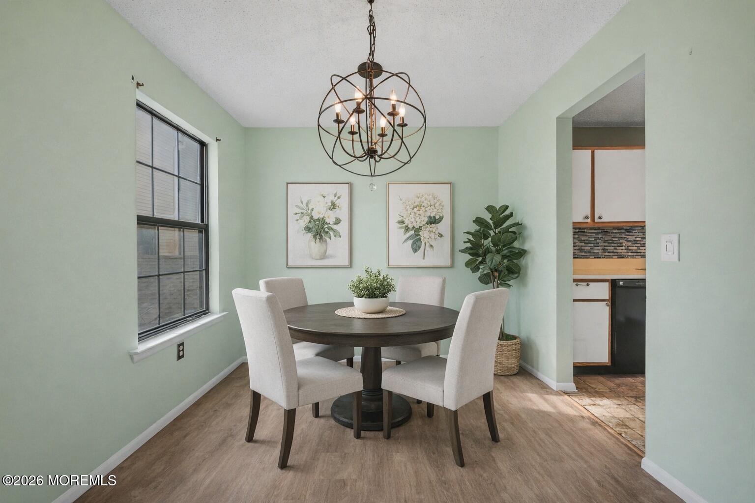 1807 Lilly Lane Jackson, NJ 08527 - Photo 7 of 31 a dining room with furniture a rug and wooden floor