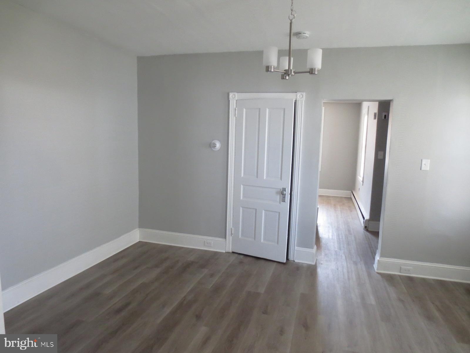 617 Benson Street Philadelphia, PA 19111 - Photo 15 of 37 wooden floor in an empty room with a window