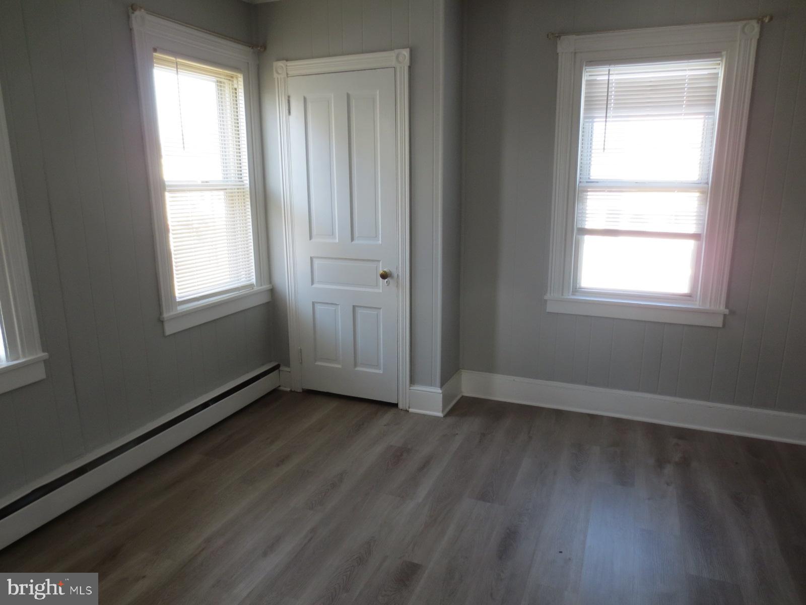 617 Benson Street Philadelphia, PA 19111 - Photo 22 of 37 an empty room with wooden floor and windows