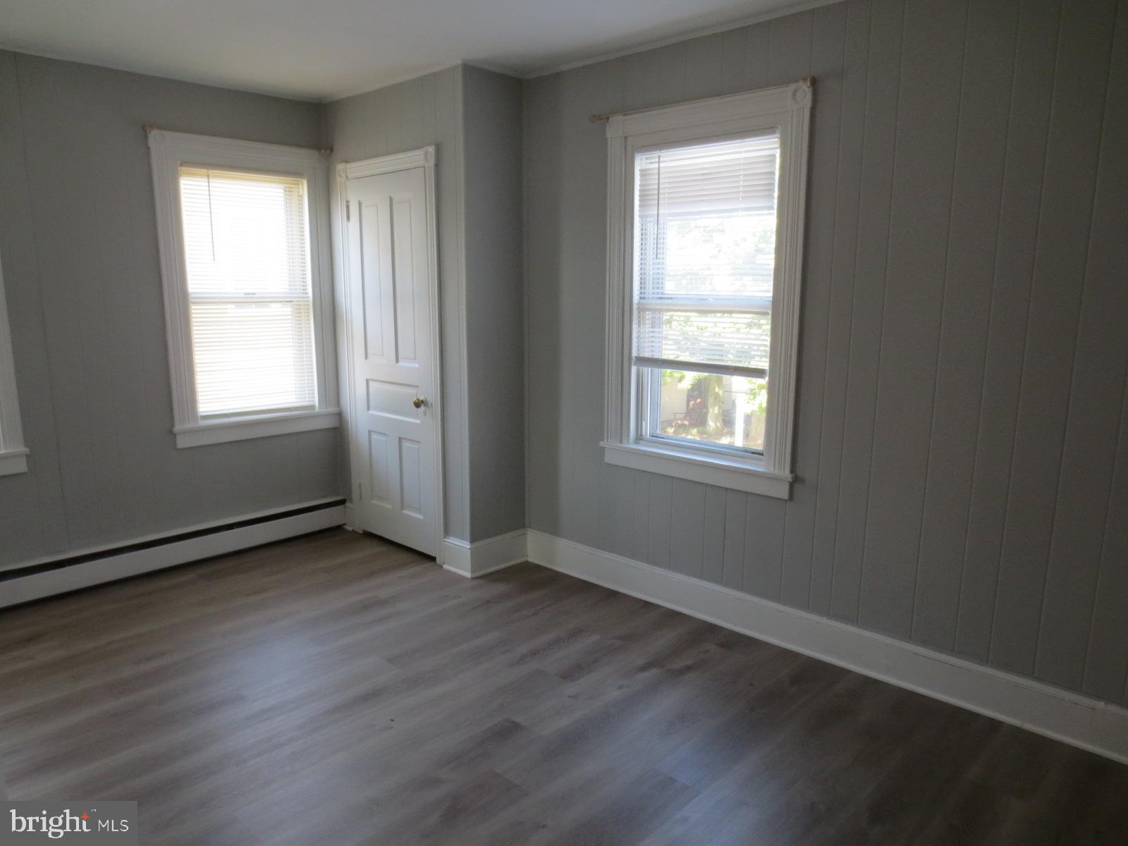 617 Benson Street Philadelphia, PA 19111 - Photo 24 of 37 a view of an empty room with wooden floor and a window
