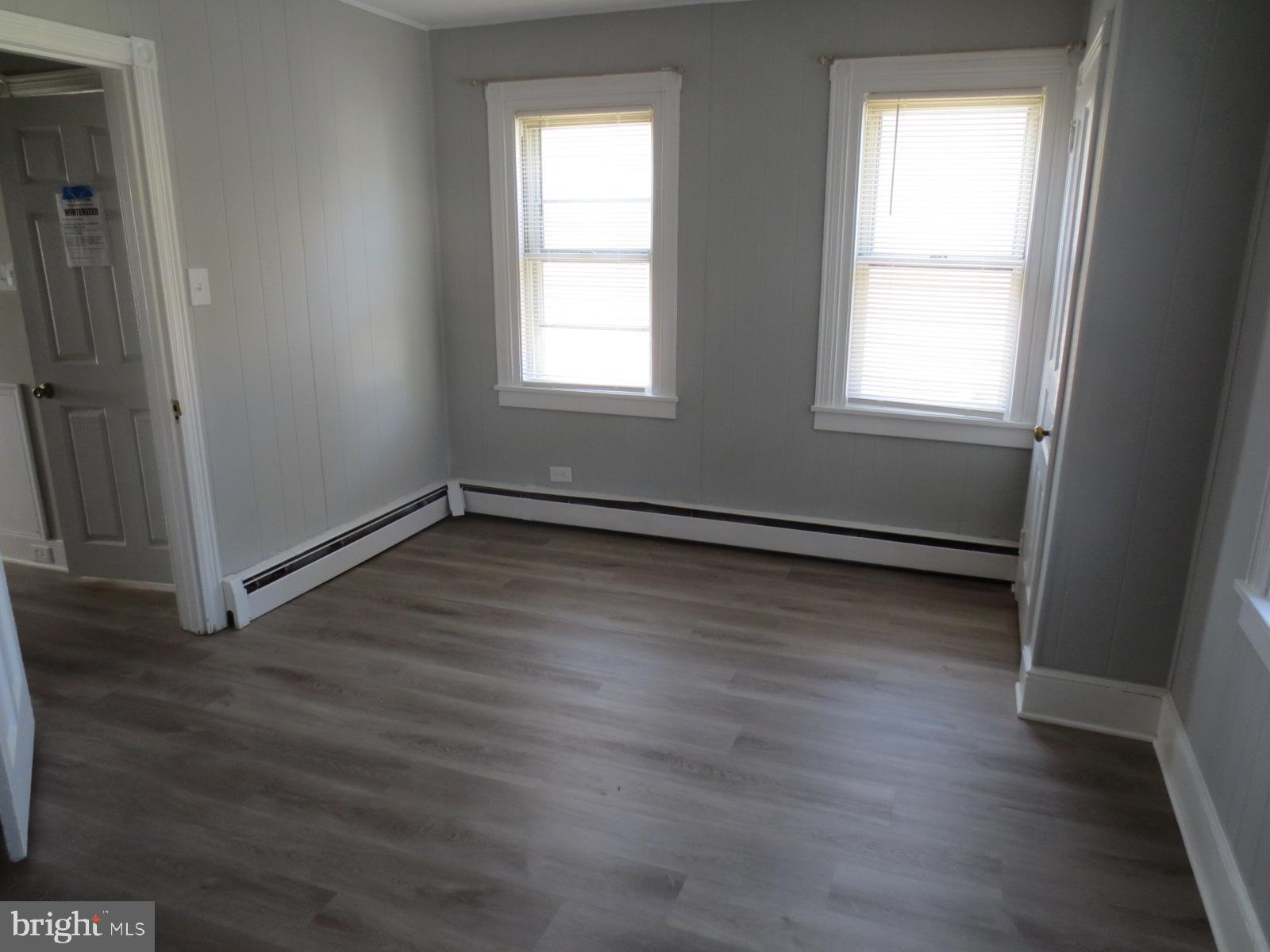 617 Benson Street Philadelphia, PA 19111 - Photo 25 of 37 an empty room with wooden floor and windows