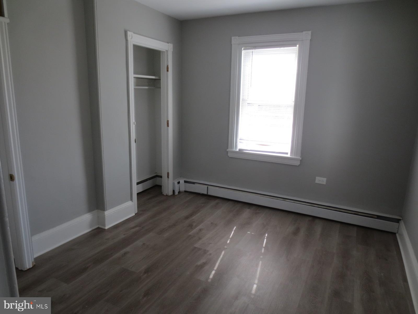 617 Benson Street Philadelphia, PA 19111 - Photo 26 of 37 an empty room with wooden floor and windows