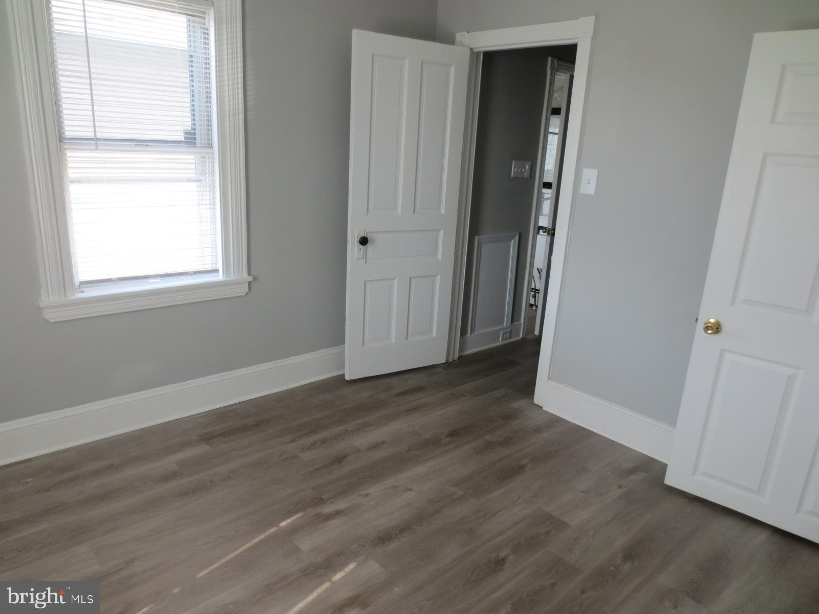 617 Benson Street Philadelphia, PA 19111 - Photo 27 of 37 an empty room with wooden floor and windows