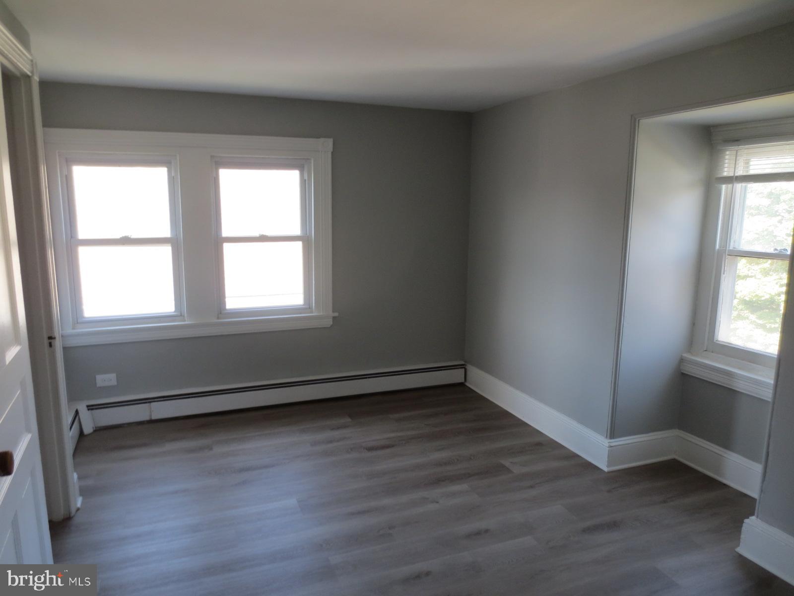 617 Benson Street Philadelphia, PA 19111 - Photo 30 of 37 an empty room with wooden floor and windows