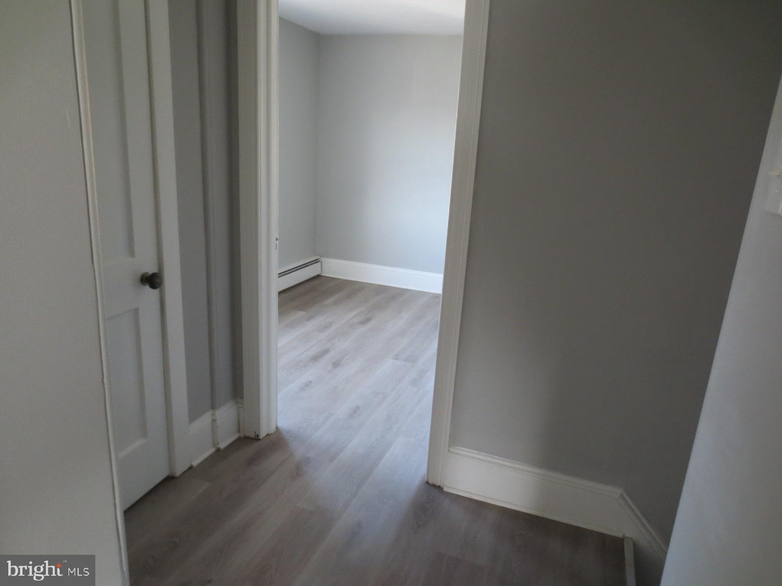 617 Benson Street Philadelphia, PA 19111 - Photo 34 of 37 a view of a hallway with wooden floor