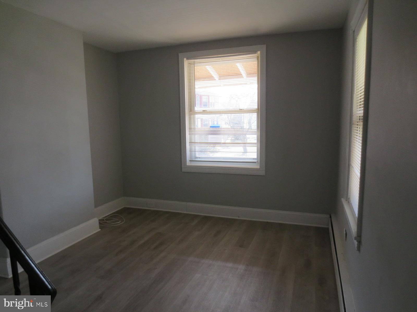 617 Benson Street Philadelphia, PA 19111 - Photo 35 of 37 an empty room with wooden floor and windows