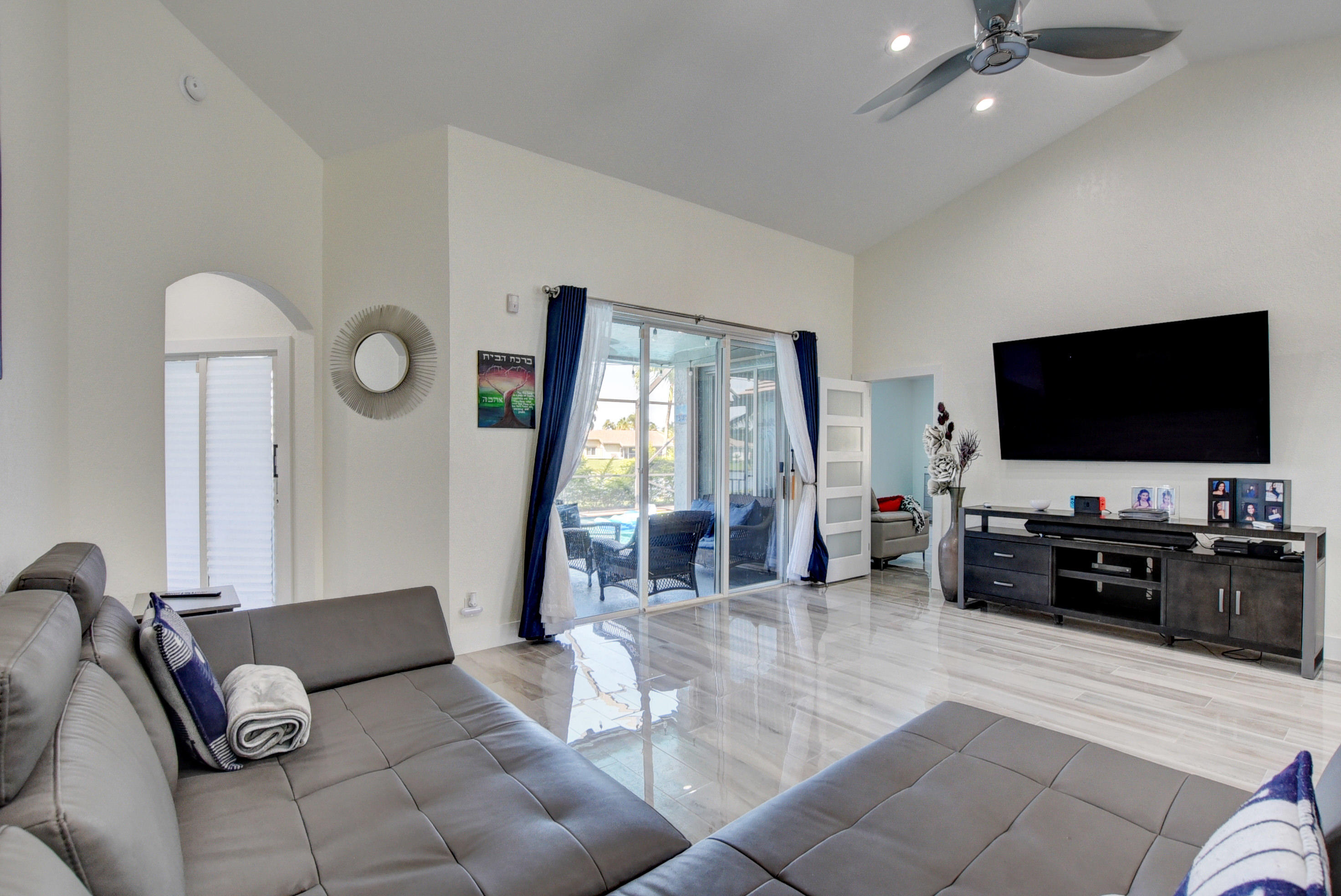 12455 Baywind Court Boca Raton, FL 33428 - Photo 4 of 34 Living Room with view of pool and lake
