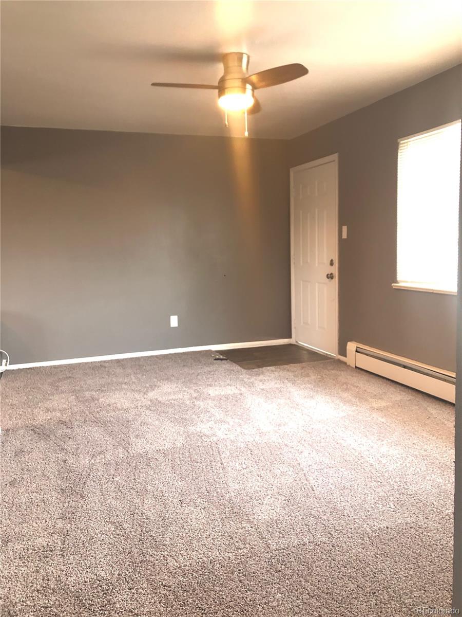 7155 Stuart Street Westminster, CO 80030 - Photo 9 of 11 a view of a room with an empty space