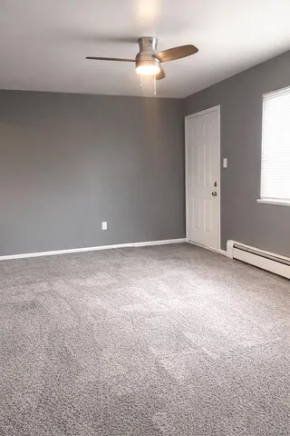 a view of an empty room with a window