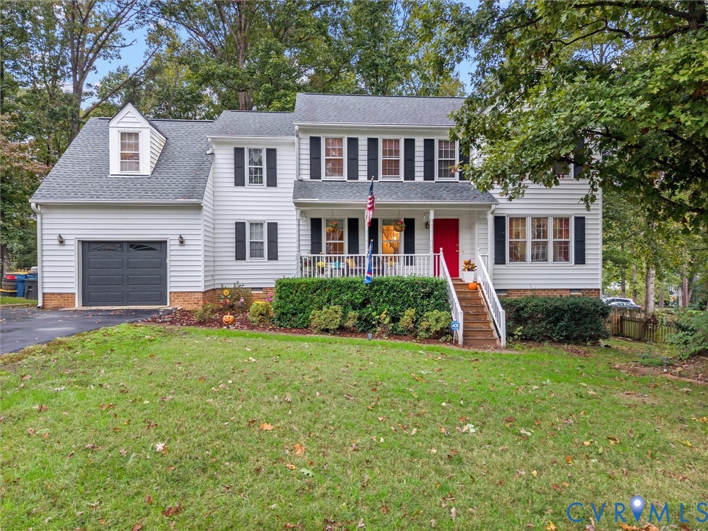 7706 Northern Dancer Court Midlothian, VA 23112 - Photo 1 of 40 a front view of a house with a yard and garage