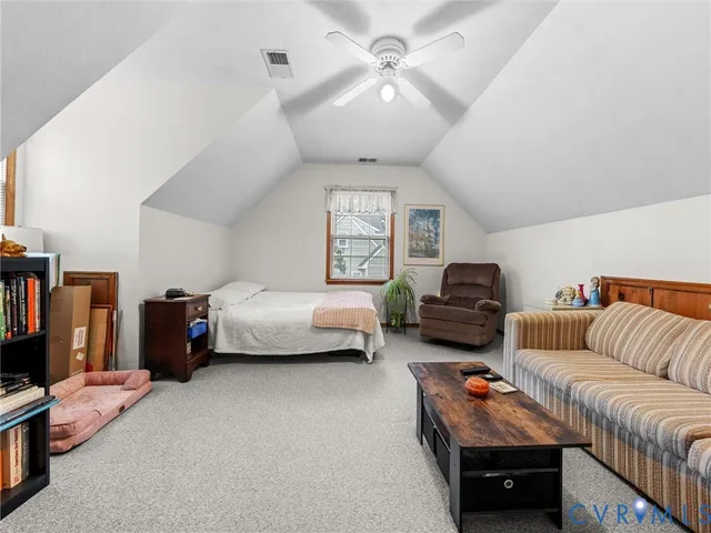 a bedroom with furniture and a chandelier
