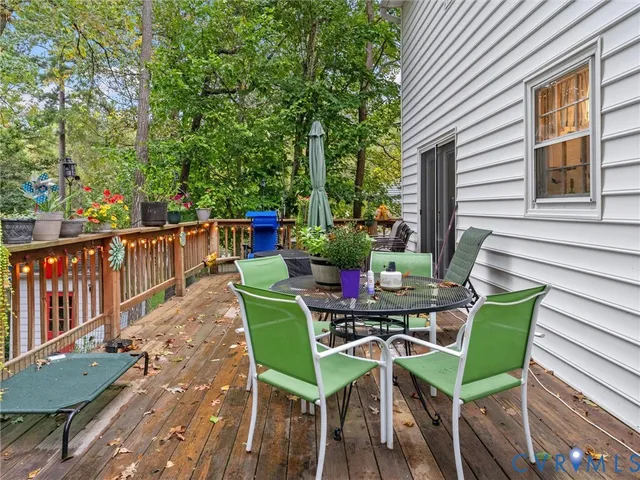 a view of a deck with furniture