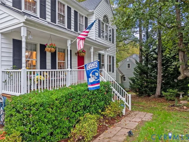a view of a house with a yard and a deck