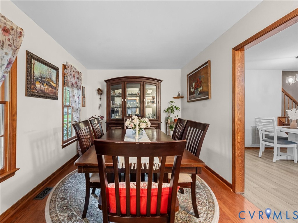 7706 Northern Dancer Court Midlothian, VA 23112 - Photo 6 of 40 a view of a dining room with furniture window and wooden floor