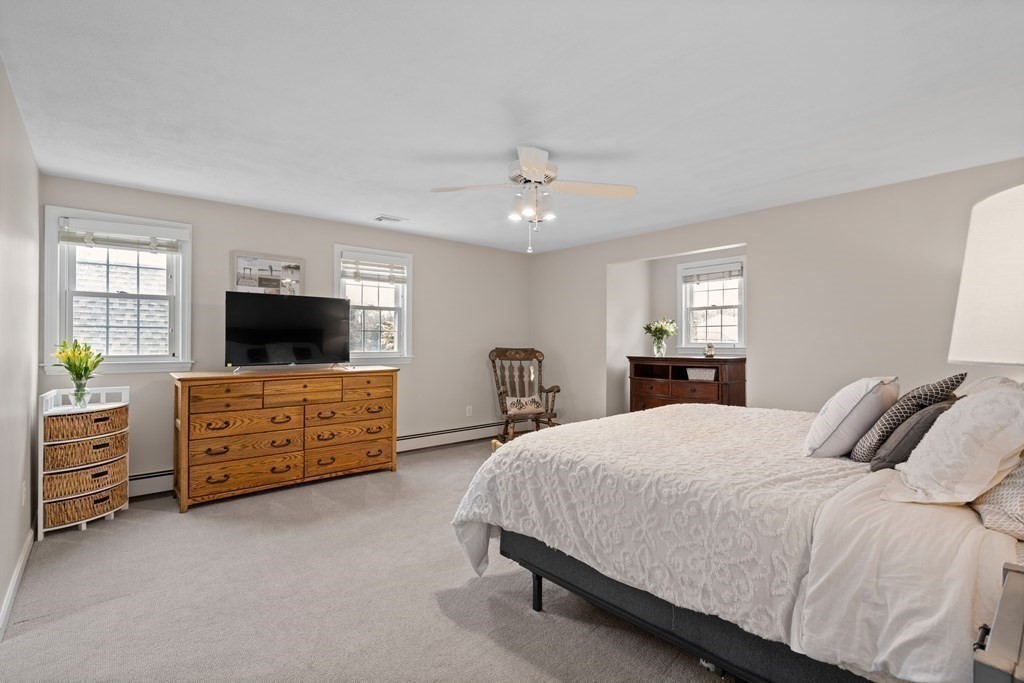 4 Robert Street Walpole, MA 02081 - Photo 13 of 37 a bedroom with a bed flat screen tv and a dresser