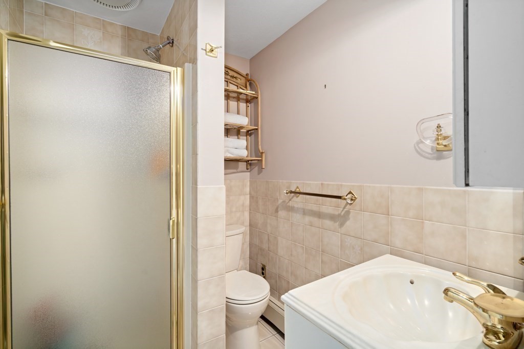 4 Robert Street Walpole, MA 02081 - Photo 15 of 37 a bathroom with a sink and toilet