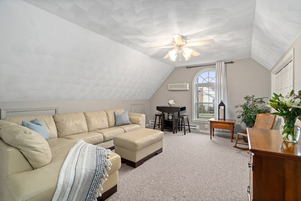 4 Robert Street Walpole, MA 02081 - Photo 19 of 37 a living room with furniture a chandelier and a chandelier