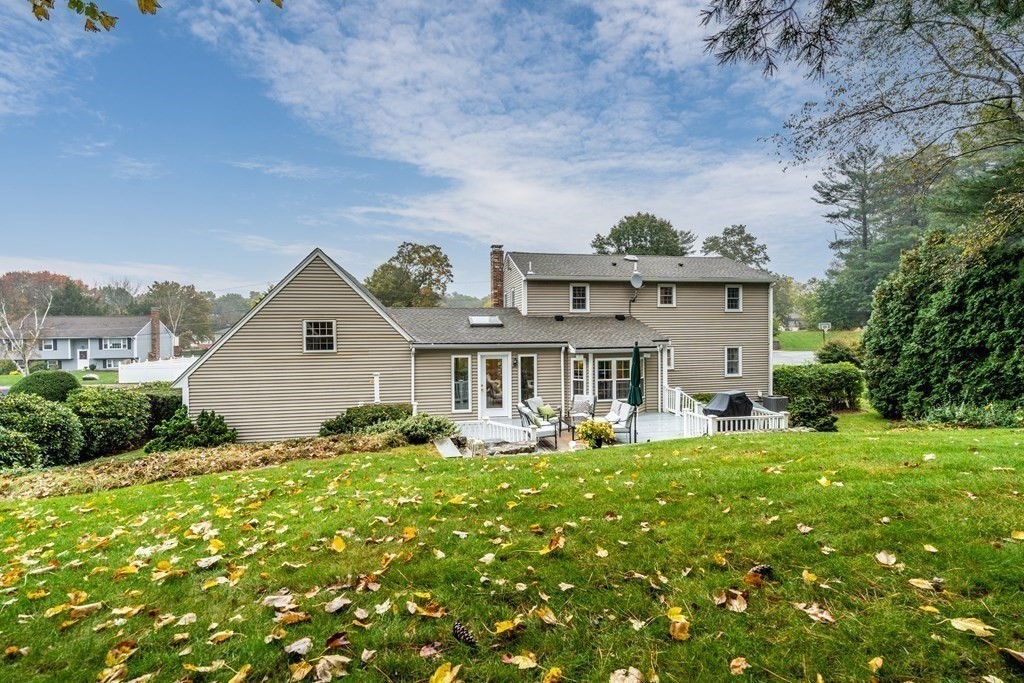 4 Robert Street Walpole, MA 02081 - Photo 2 of 37 a front view of a house with garden