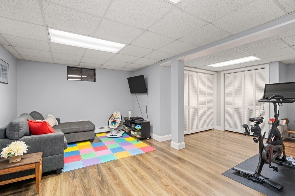4 Robert Street Walpole, MA 02081 - Photo 24 of 37 a living room with furniture and a wooden floor