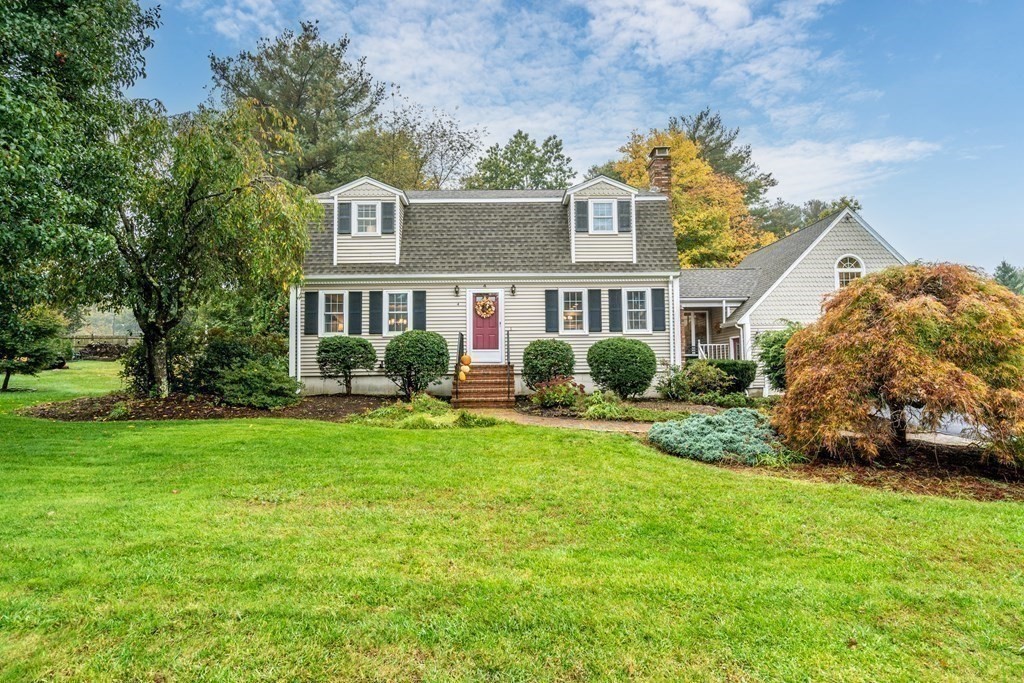 4 Robert Street Walpole, MA 02081 - Photo 29 of 37 a front view of a house with a garden