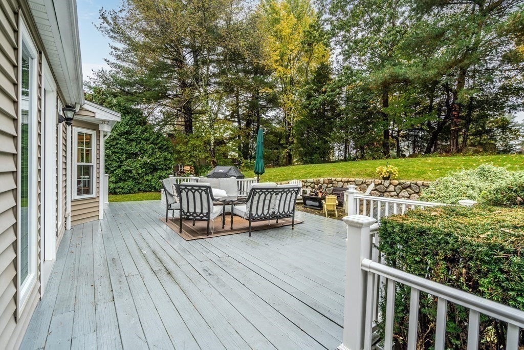 4 Robert Street Walpole, MA 02081 - Photo 31 of 37 a view of a chairs and table on the wooden deck
