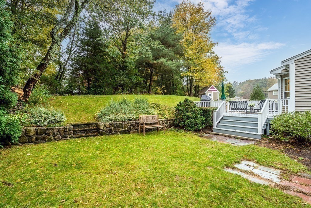 4 Robert Street Walpole, MA 02081 - Photo 33 of 37 a view of a bench in a garden